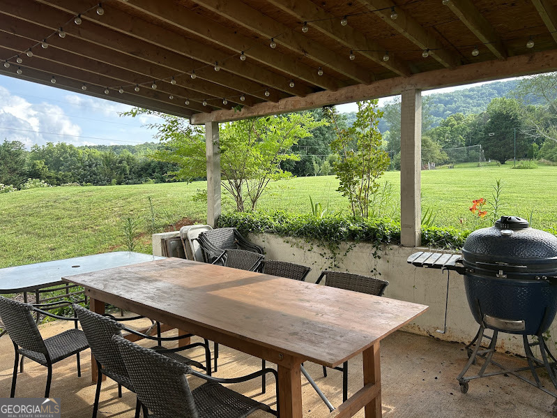 2838 Skitts Mountain Road Cleveland, GA 30528 - Photo 22 of 41 a view of an outdoor space with furniture and garden
