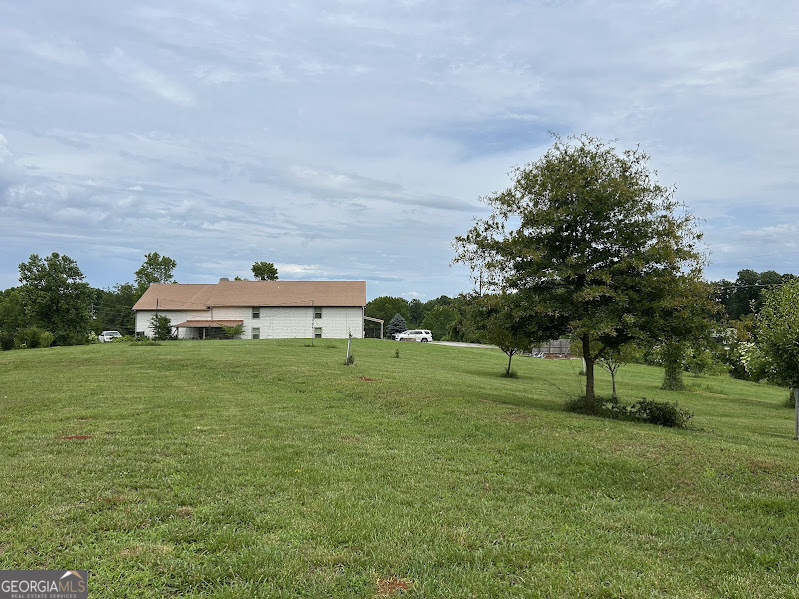 2838 Skitts Mountain Road Cleveland, GA 30528 - Photo 25 of 41 a view of an house with a big yard