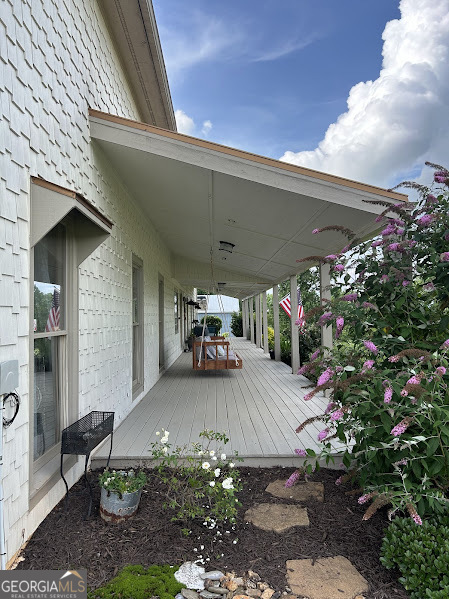2838 Skitts Mountain Road Cleveland, GA 30528 - Photo 29 of 41 a view of a patio with table and chairs and potted plants