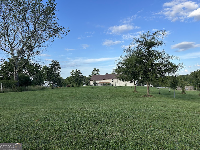 2838 Skitts Mountain Road Cleveland, GA 30528 - Photo 32 of 41 a view of a grassy field with trees