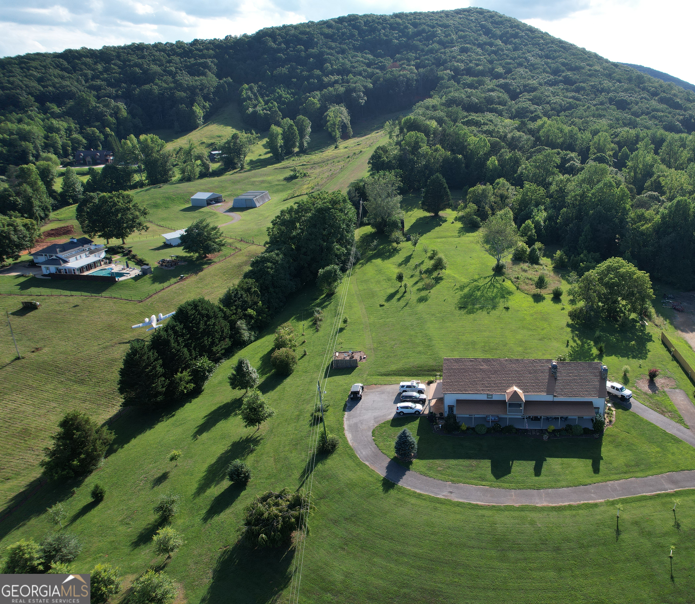 2838 Skitts Mountain Road Cleveland, GA 30528 - Photo 37 of 41 an aerial view of a house with outdoor space and a street view