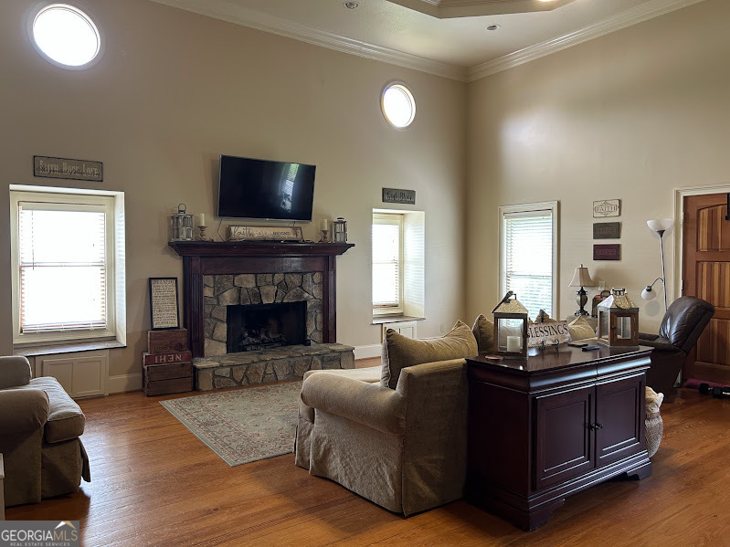 2838 Skitts Mountain Road Cleveland, GA 30528 - Photo 8 of 41 a living room with furniture flat screen tv and a fireplace
