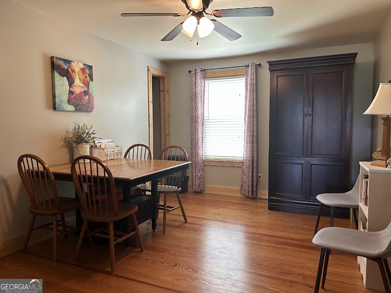 2838 Skitts Mountain Road Cleveland, GA 30528 - Photo 10 of 41 a view of a dining room with furniture window and wooden floor