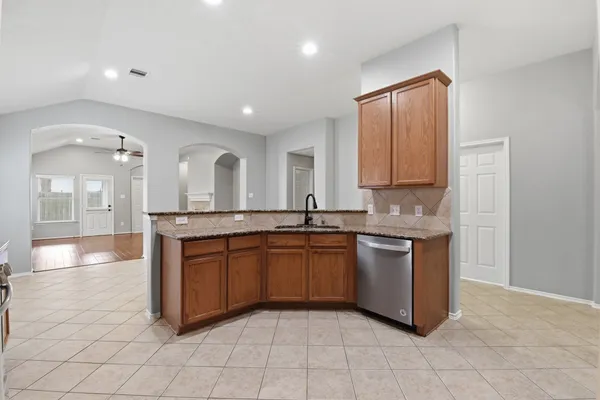 a large bathroom with a sink and a large mirror
