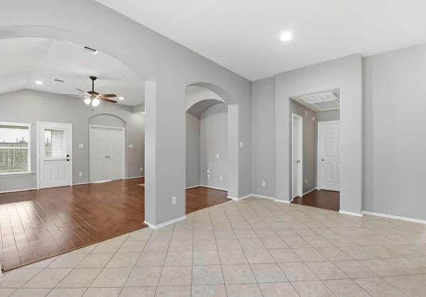 a view of a room with wooden floor and staircase