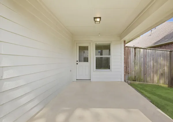 a backyard of a house with lots of green space
