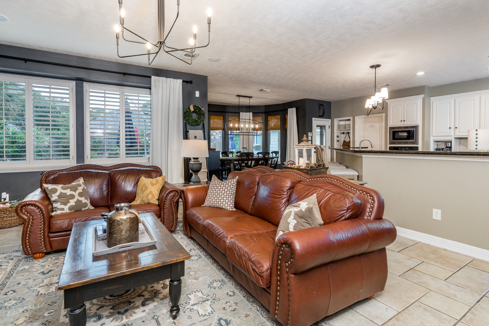 10411 Harnwell Crossing Drive Spring, TX 77379 - Photo 11 of 50 a living room with furniture fireplace and a large window