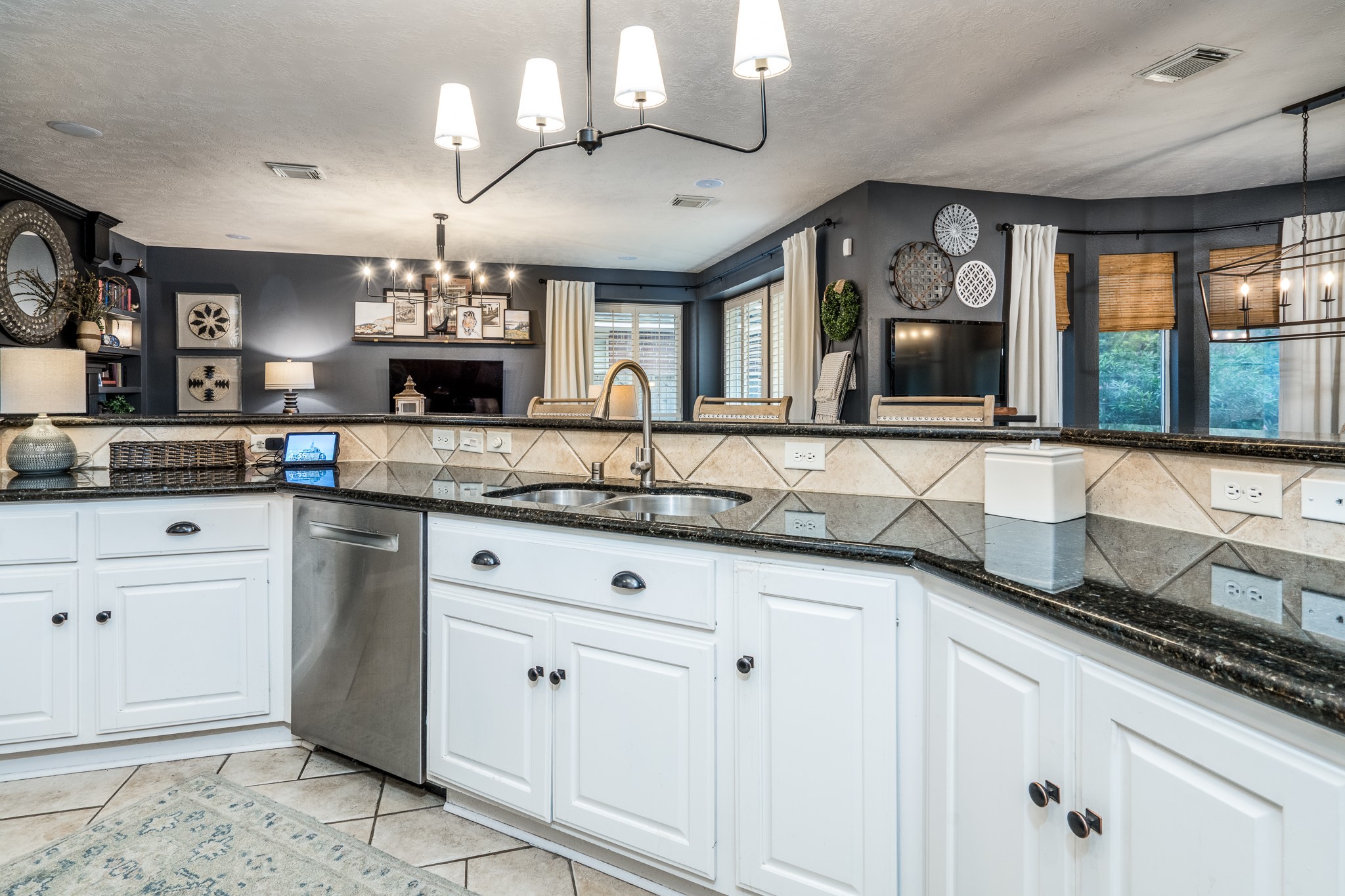 10411 Harnwell Crossing Drive Spring, TX 77379 - Photo 12 of 50 a kitchen with granite countertop a sink cabinets and window