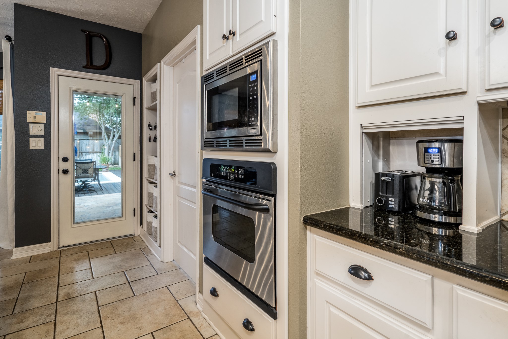10411 Harnwell Crossing Drive Spring, TX 77379 - Photo 15 of 50 a kitchen with granite countertop a stove and a refrigerator