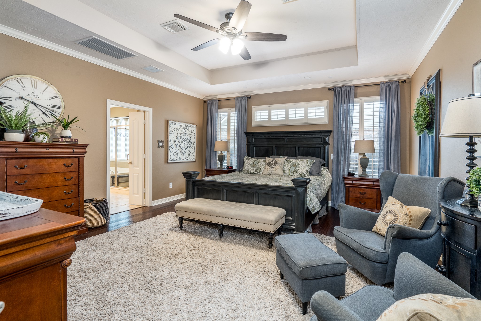 10411 Harnwell Crossing Drive Spring, TX 77379 - Photo 18 of 50 a bedroom with furniture and a fireplace