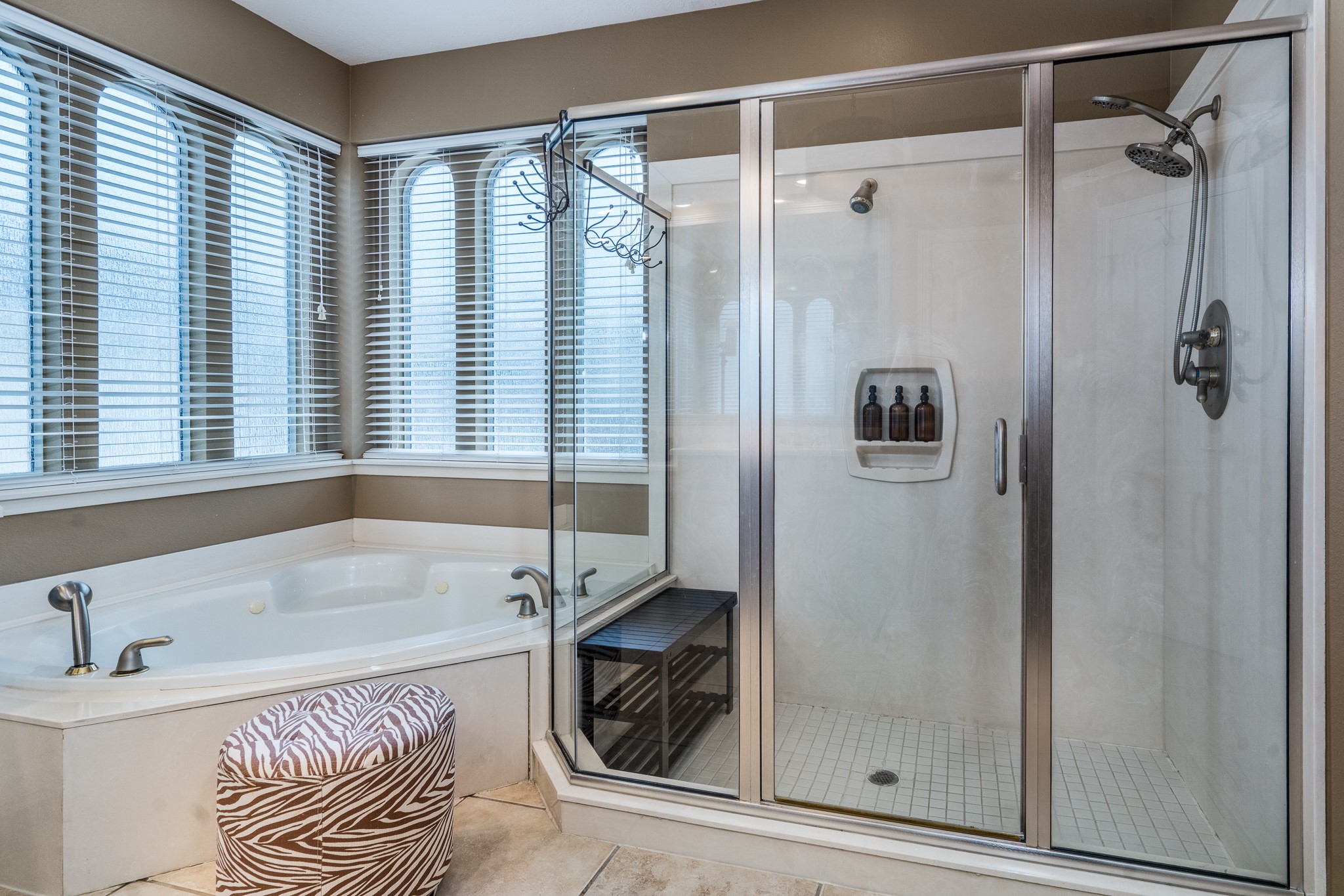 10411 Harnwell Crossing Drive Spring, TX 77379 - Photo 21 of 50 a bathroom with a tub and a shower