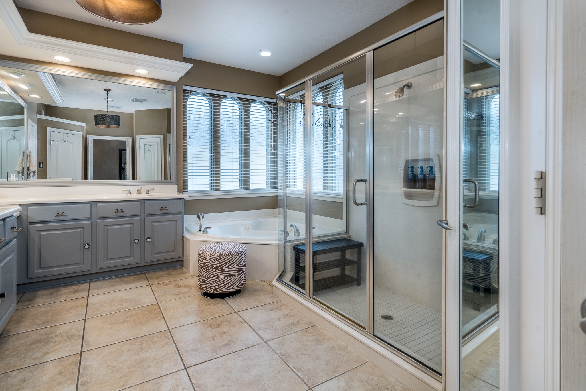 10411 Harnwell Crossing Drive Spring, TX 77379 - Photo 22 of 50 a bathroom with a granite countertop sink mirror and toilet
