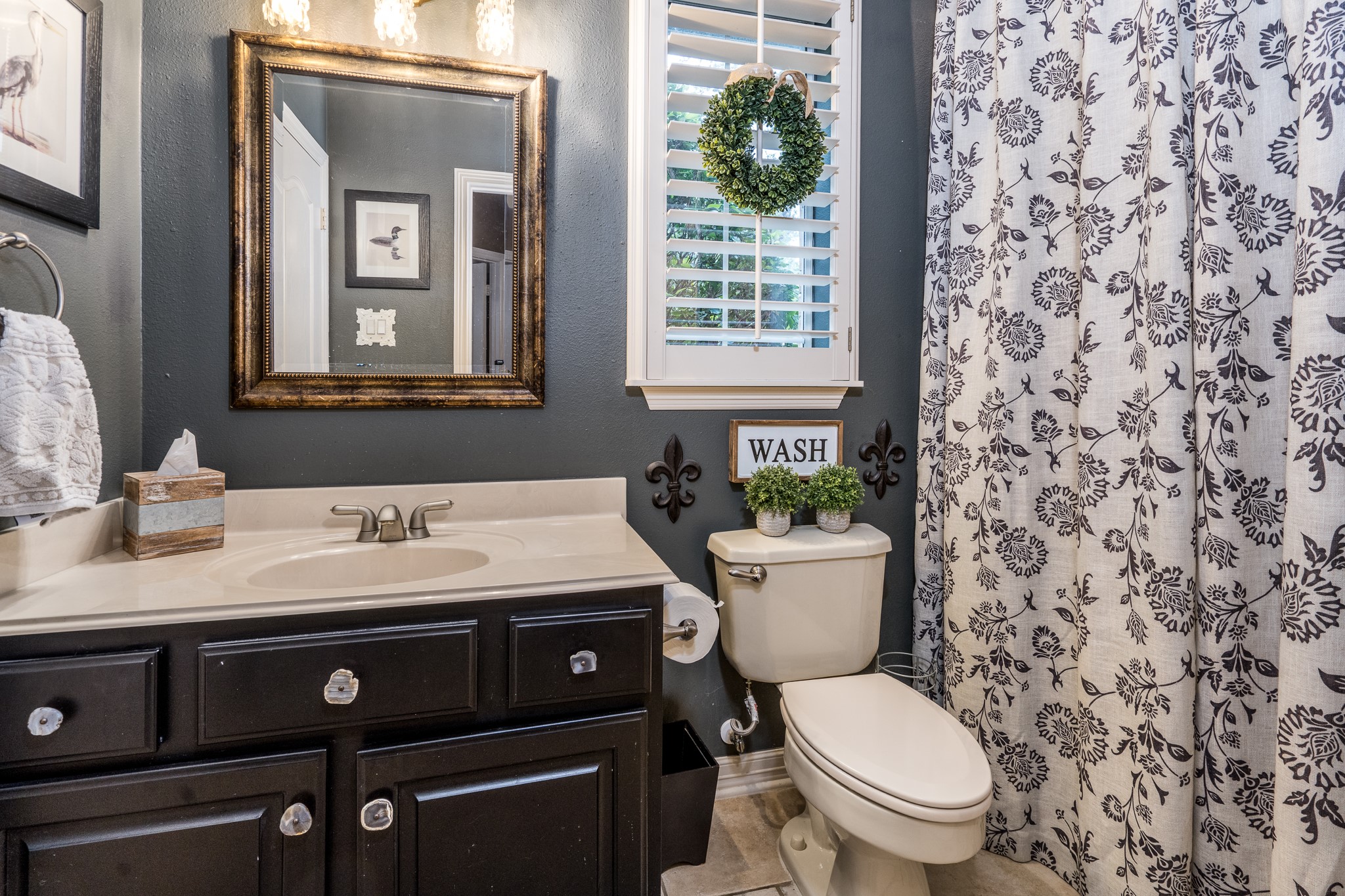 10411 Harnwell Crossing Drive Spring, TX 77379 - Photo 25 of 50 a bathroom with a granite countertop toilet sink and mirror