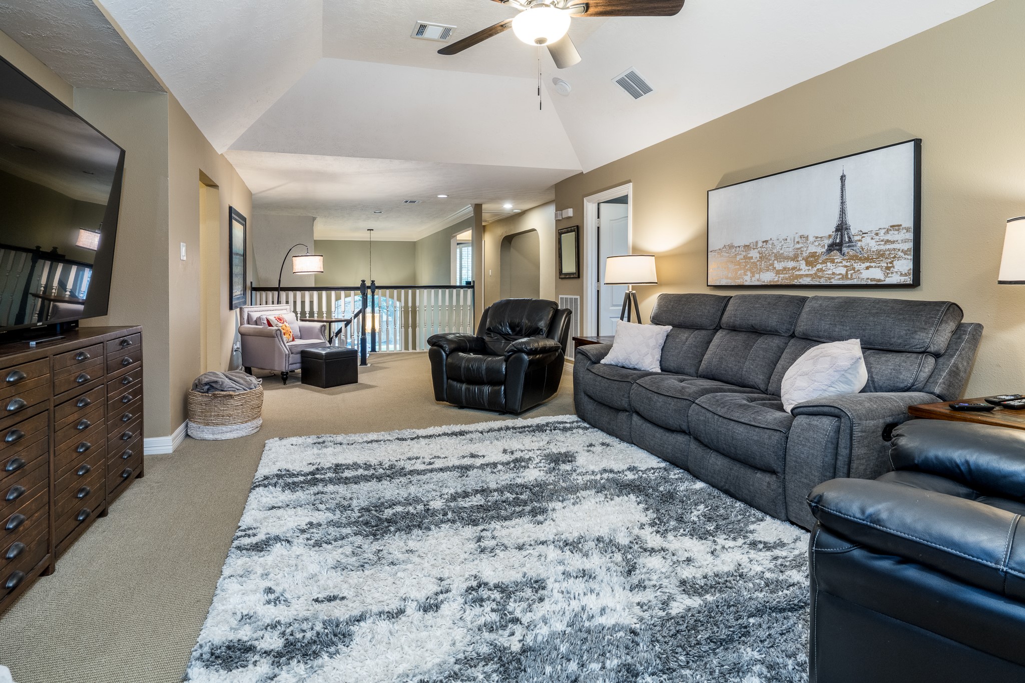 10411 Harnwell Crossing Drive Spring, TX 77379 - Photo 26 of 50 a living room with furniture and a flat screen tv