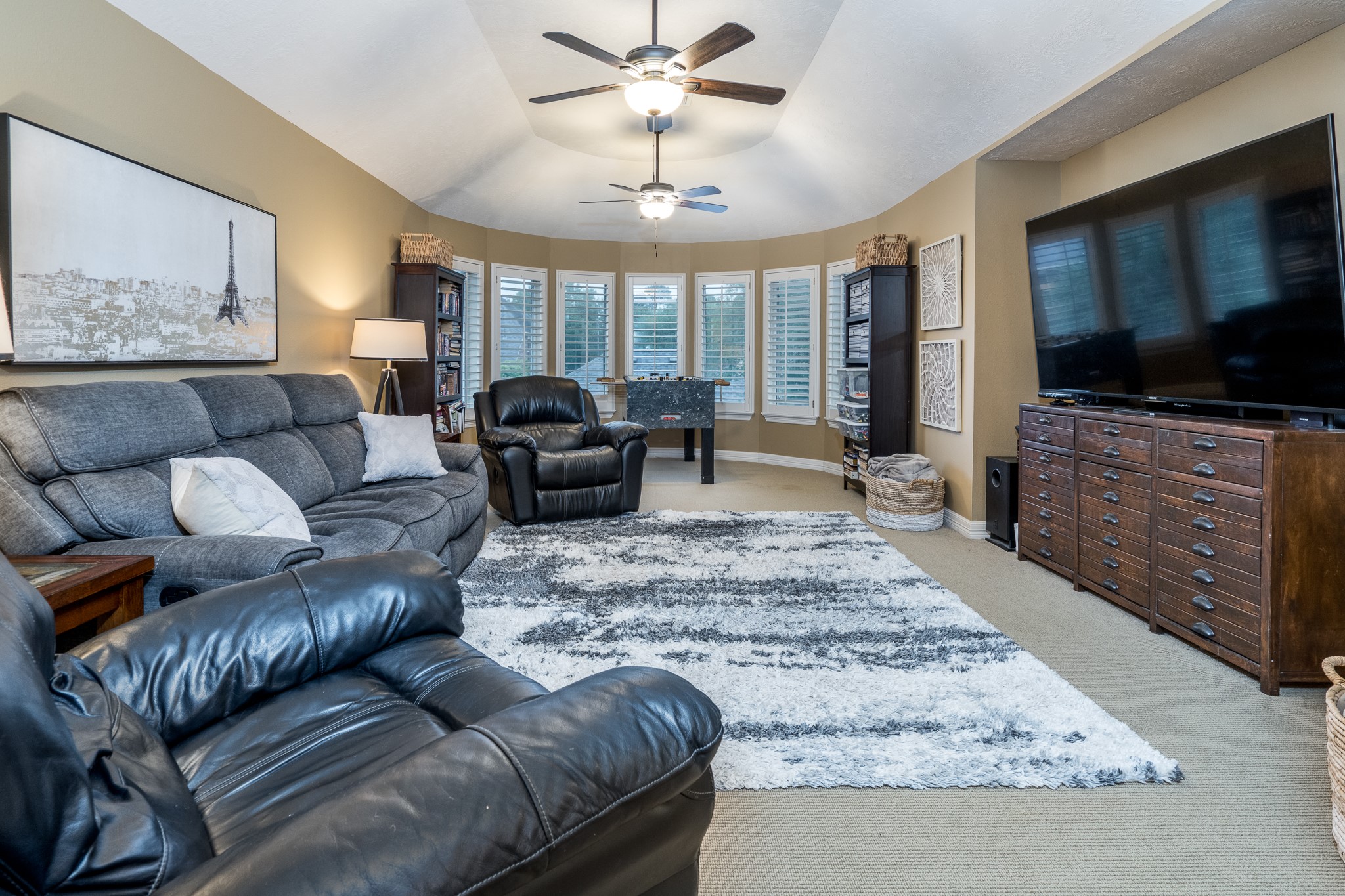 10411 Harnwell Crossing Drive Spring, TX 77379 - Photo 27 of 50 a living room with furniture and a flat screen tv