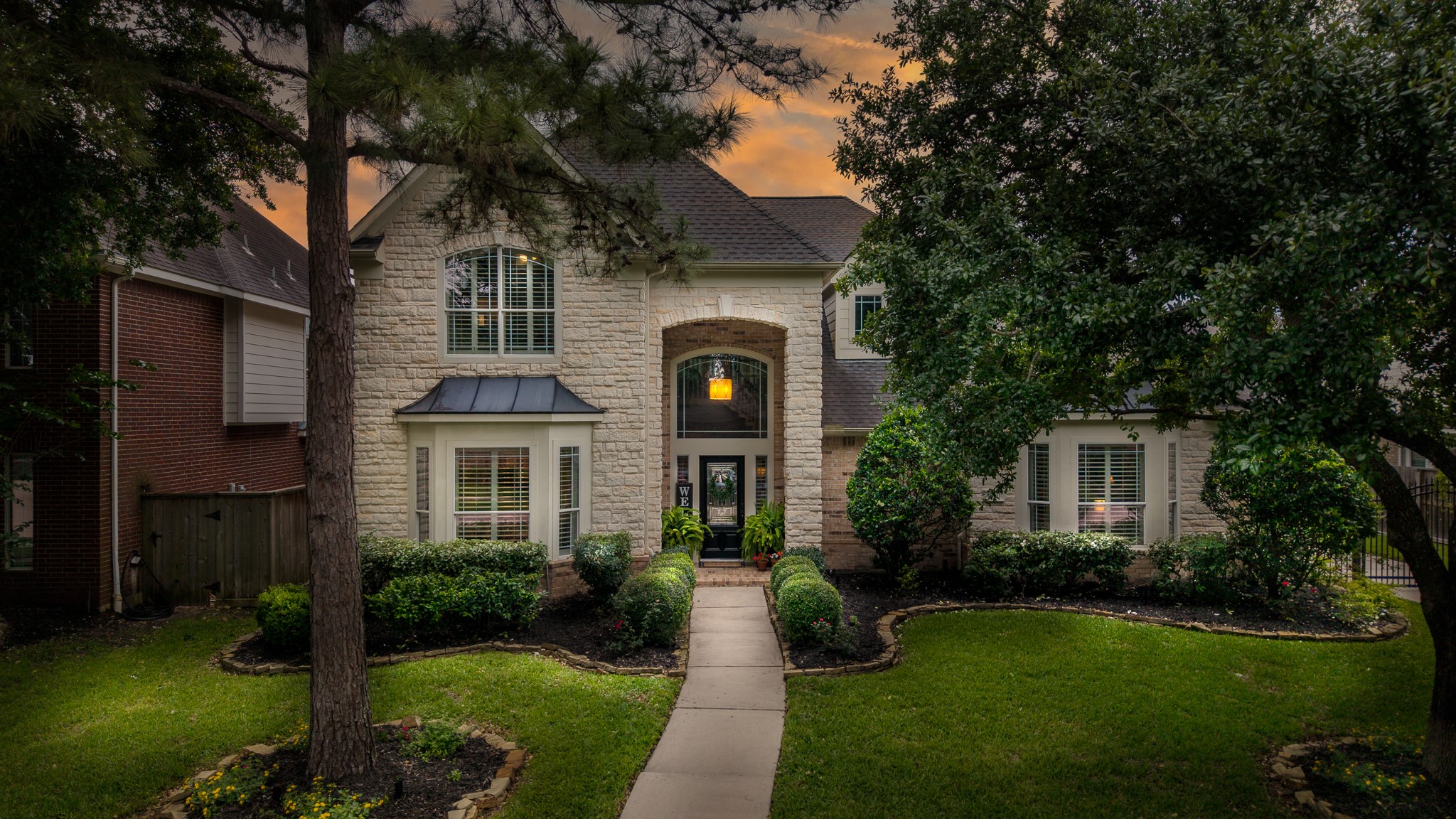 10411 Harnwell Crossing Drive Spring, TX 77379 - Photo 3 of 50 a front view of a house with garden