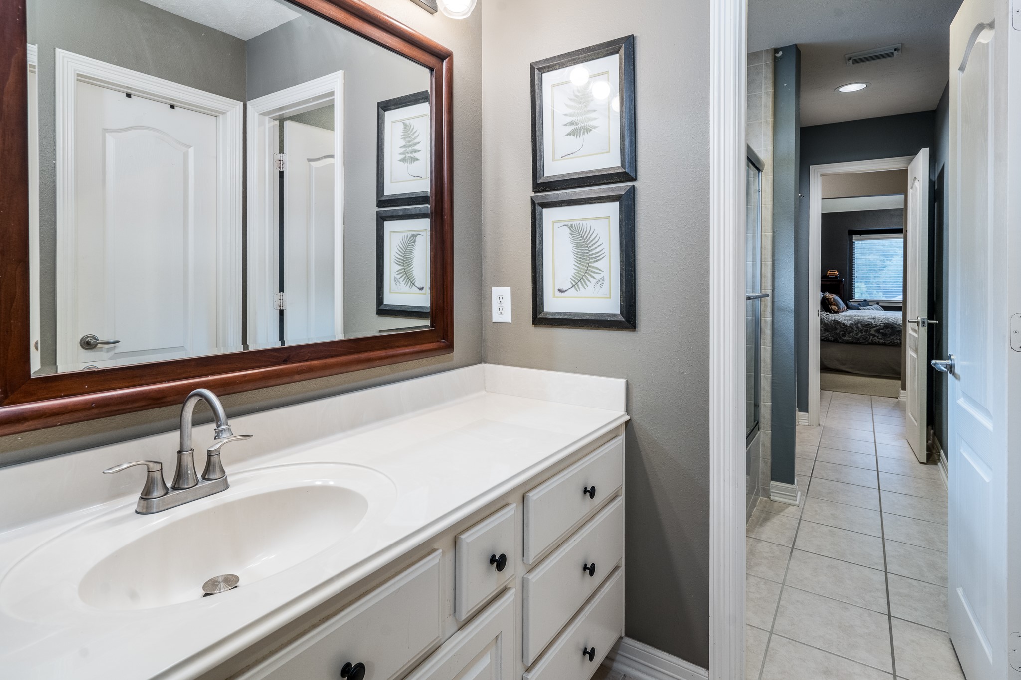 10411 Harnwell Crossing Drive Spring, TX 77379 - Photo 31 of 50 a bathroom with a sink and a mirror