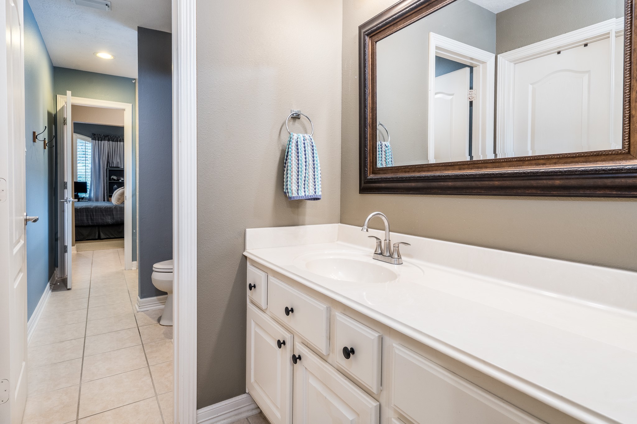 10411 Harnwell Crossing Drive Spring, TX 77379 - Photo 33 of 50 a bathroom with a sink and a mirror