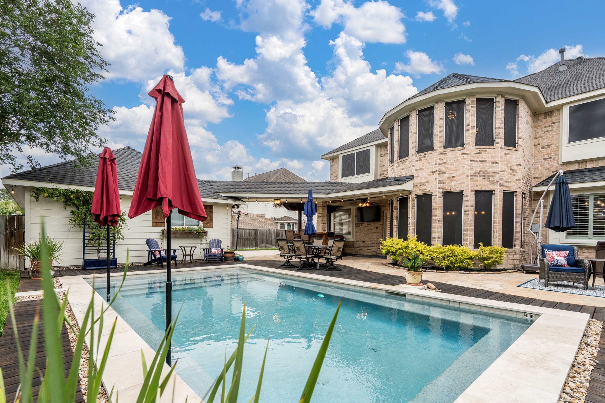 10411 Harnwell Crossing Drive Spring, TX 77379 - Photo 37 of 50 a swimming pool with outdoor seating and yard