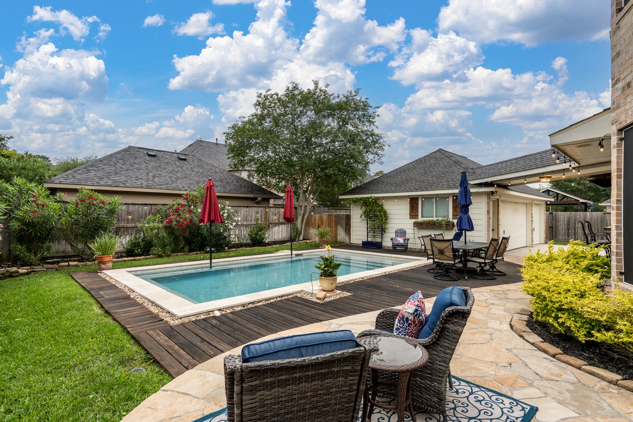 10411 Harnwell Crossing Drive Spring, TX 77379 - Photo 40 of 50 a view of house with swimming pool and furniture