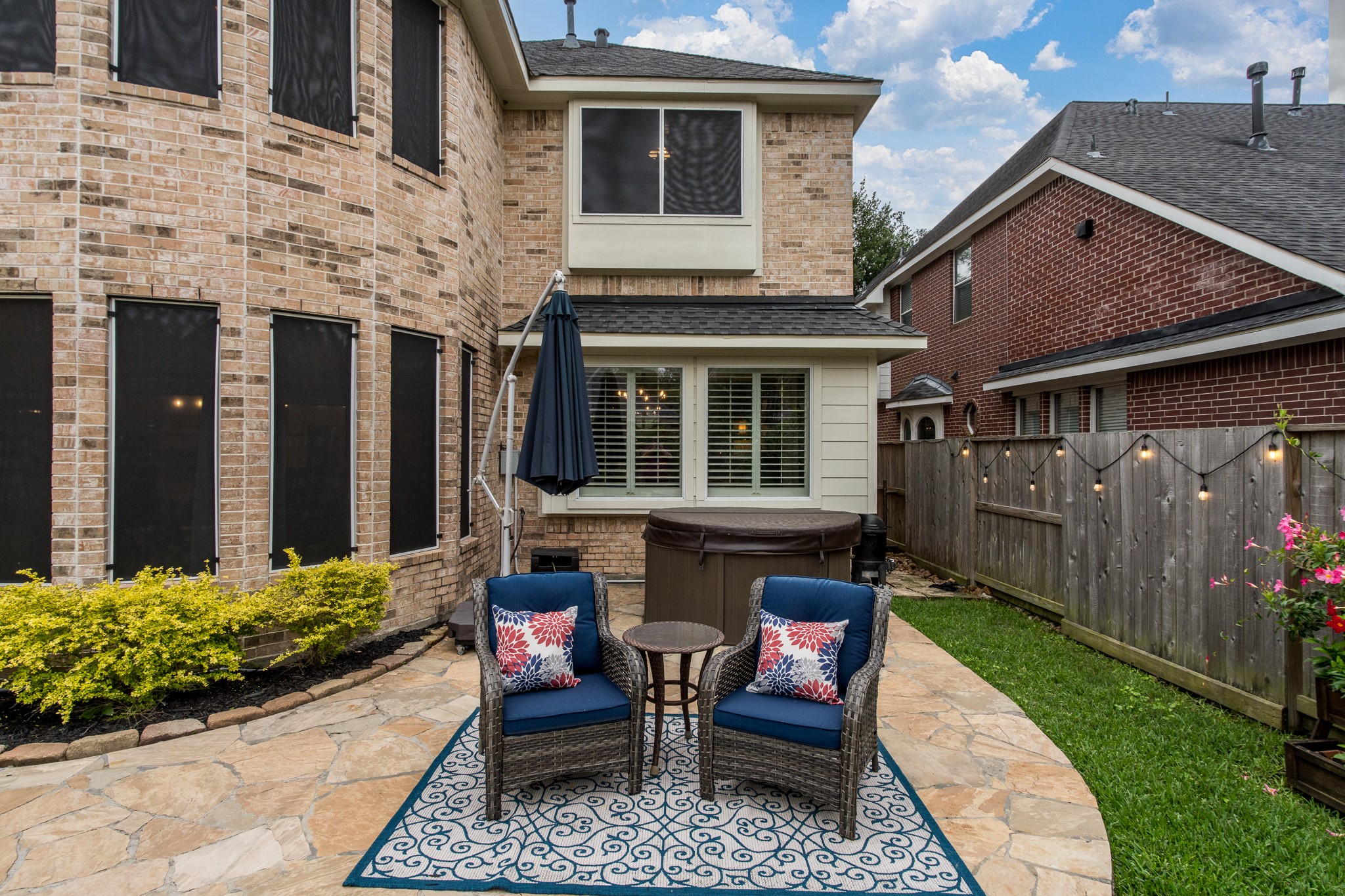 10411 Harnwell Crossing Drive Spring, TX 77379 - Photo 41 of 50 a view of house with a chairs in patio