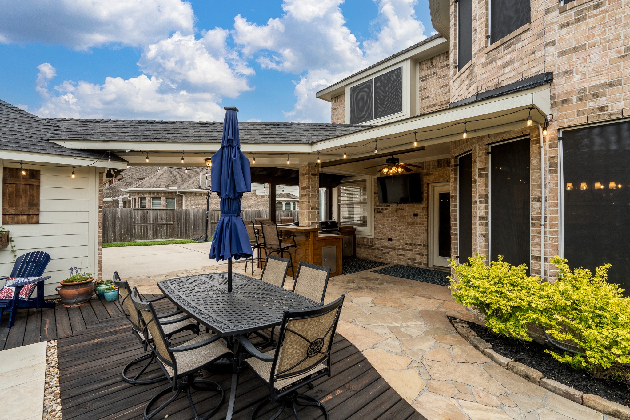 10411 Harnwell Crossing Drive Spring, TX 77379 - Photo 42 of 50 a view of a patio with a table and chairs