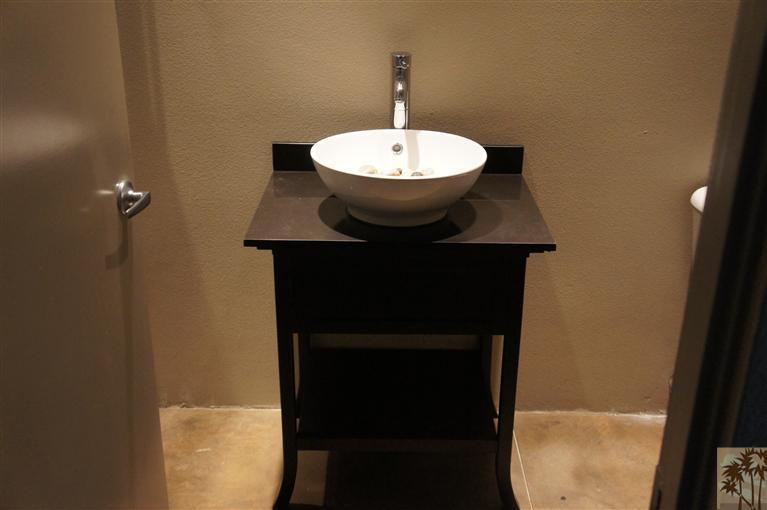 71299 Biskra Road Rancho Mirage, CA 92270 - Photo 7 of 10 a bathroom with a sink and a mirror