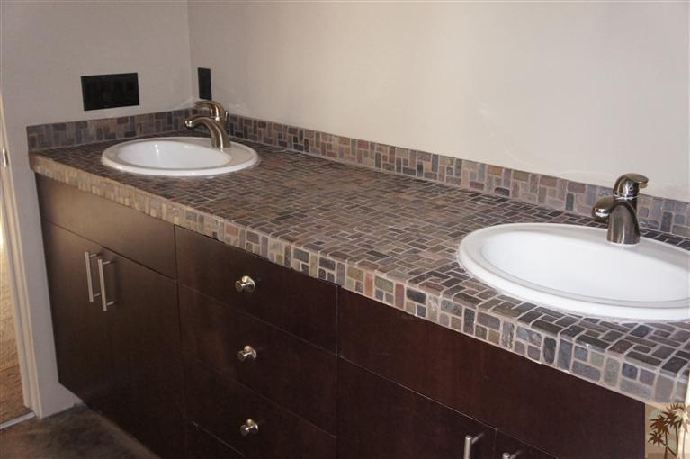 71299 Biskra Road Rancho Mirage, CA 92270 - Photo 8 of 10 a bathroom with sink and mirror