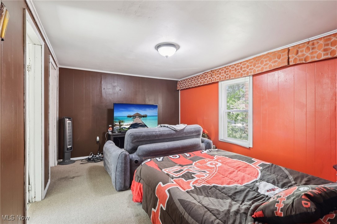 764 Chalker Street Akron, OH 44310 - Photo 13 of 34 Bedroom featuring wooden walls and carpet