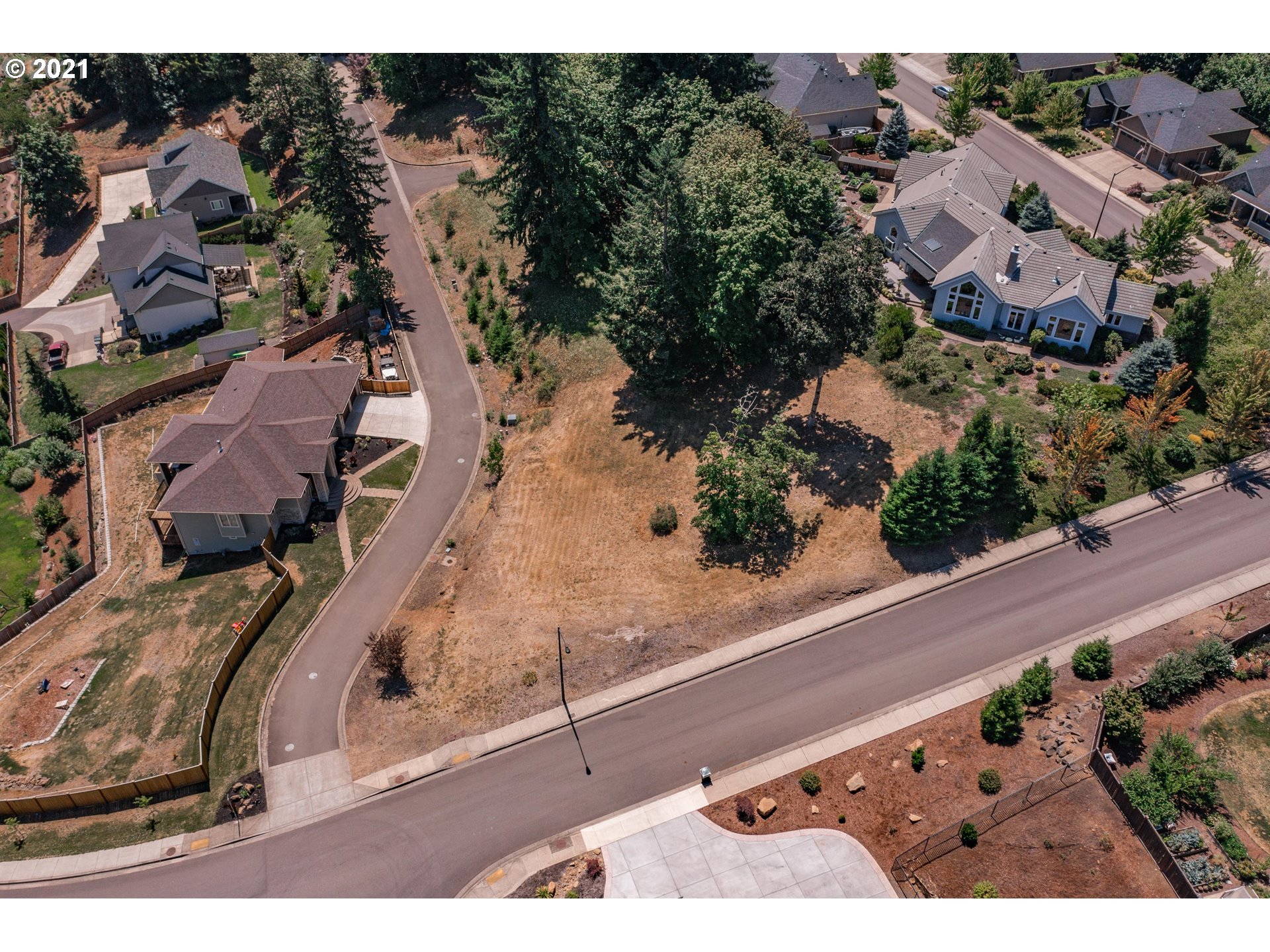 6275 Graystone Loop Springfield, OR 97478 - Photo 3 of 6 an aerial view of a house with a yard and lake view