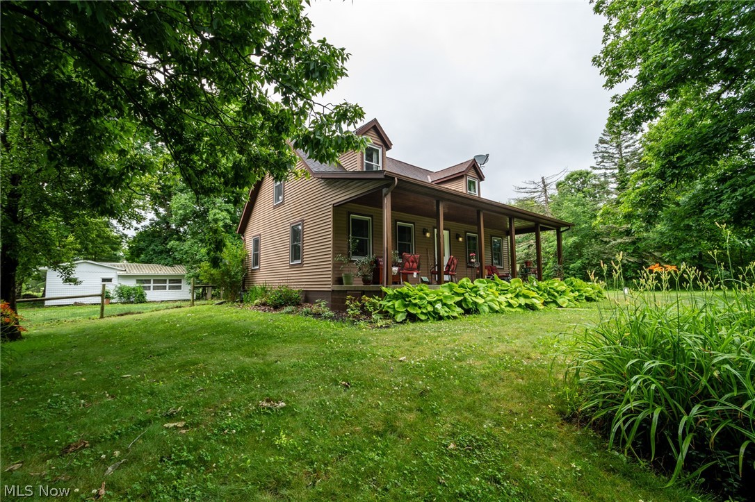 14027 Mayfield Road Huntsburg, OH 44046 - Photo 1 of 50 Front of house & shed