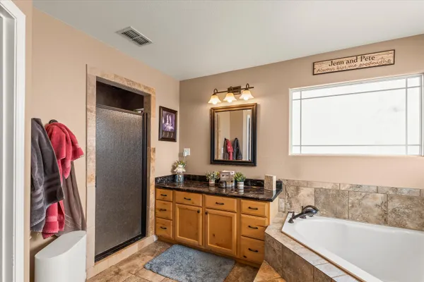 a bathroom with a bathtub and a sink