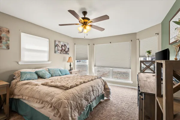a bedroom with a bed and window