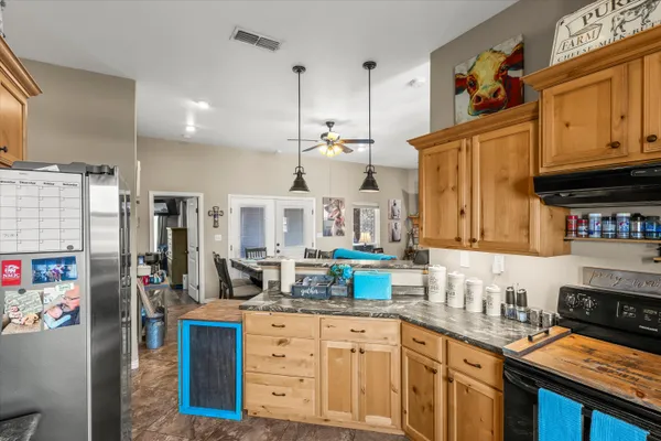 a kitchen with stainless steel appliances granite countertop a stove and a sink