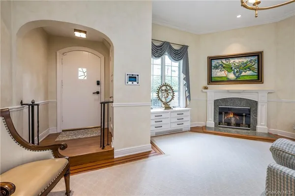 a view of a livingroom with a fireplace and furniture