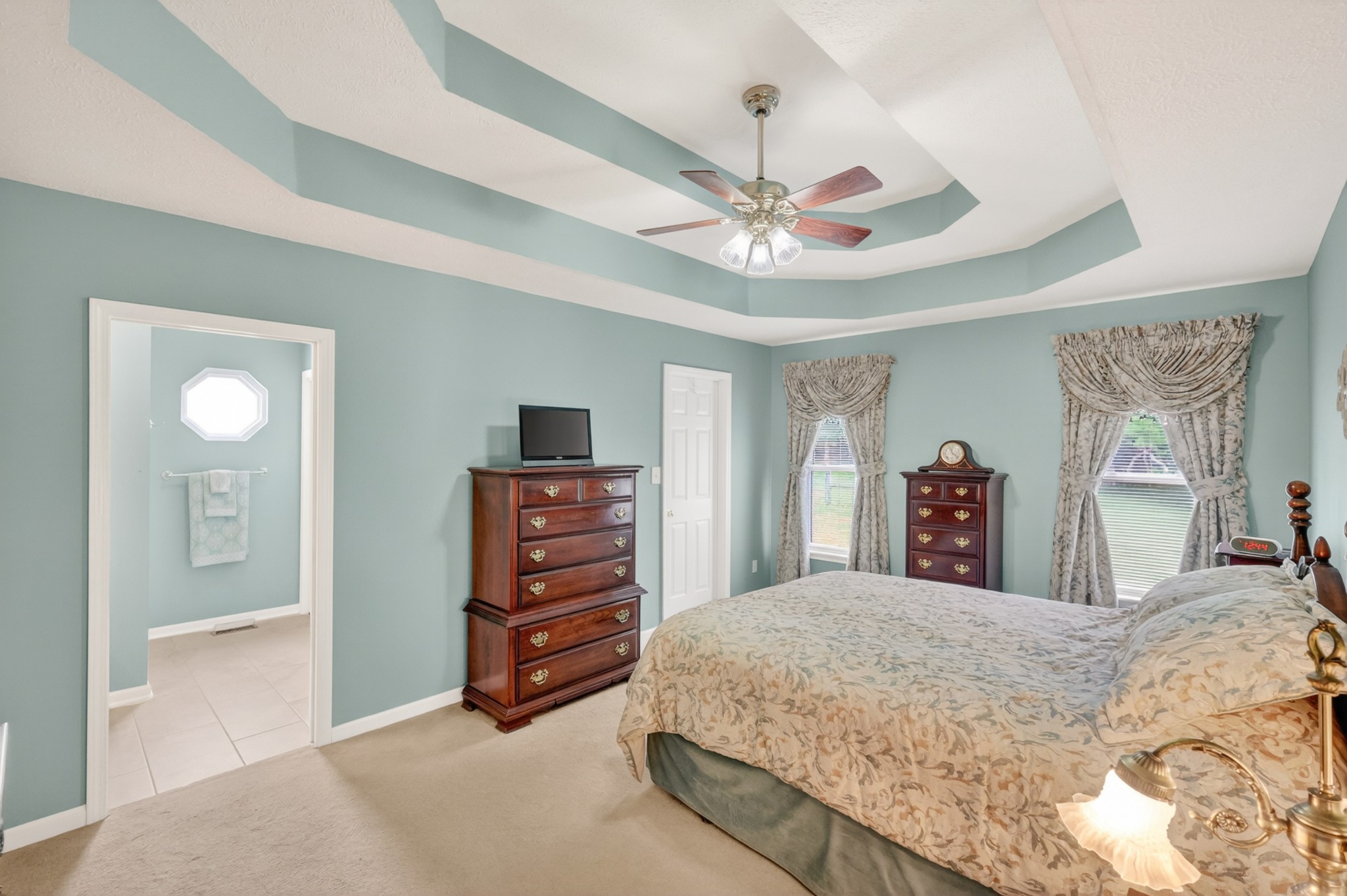 590 Allisona Road Eagleville, TN 37060 - Photo 21 of 55 a bedroom with a bed and a chandelier