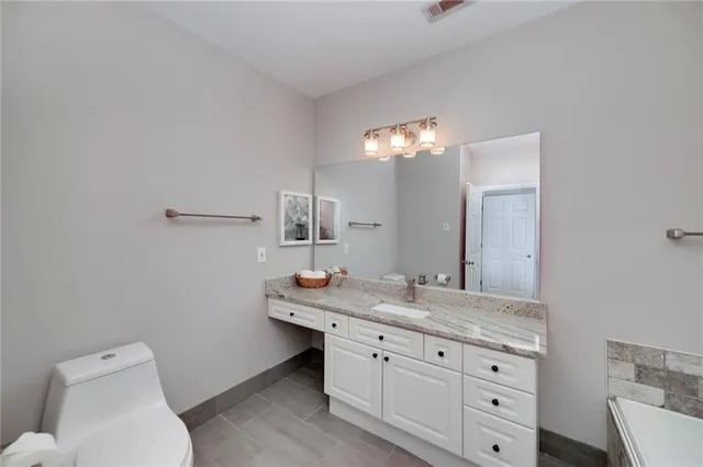a bathroom with a bathtub and a sink