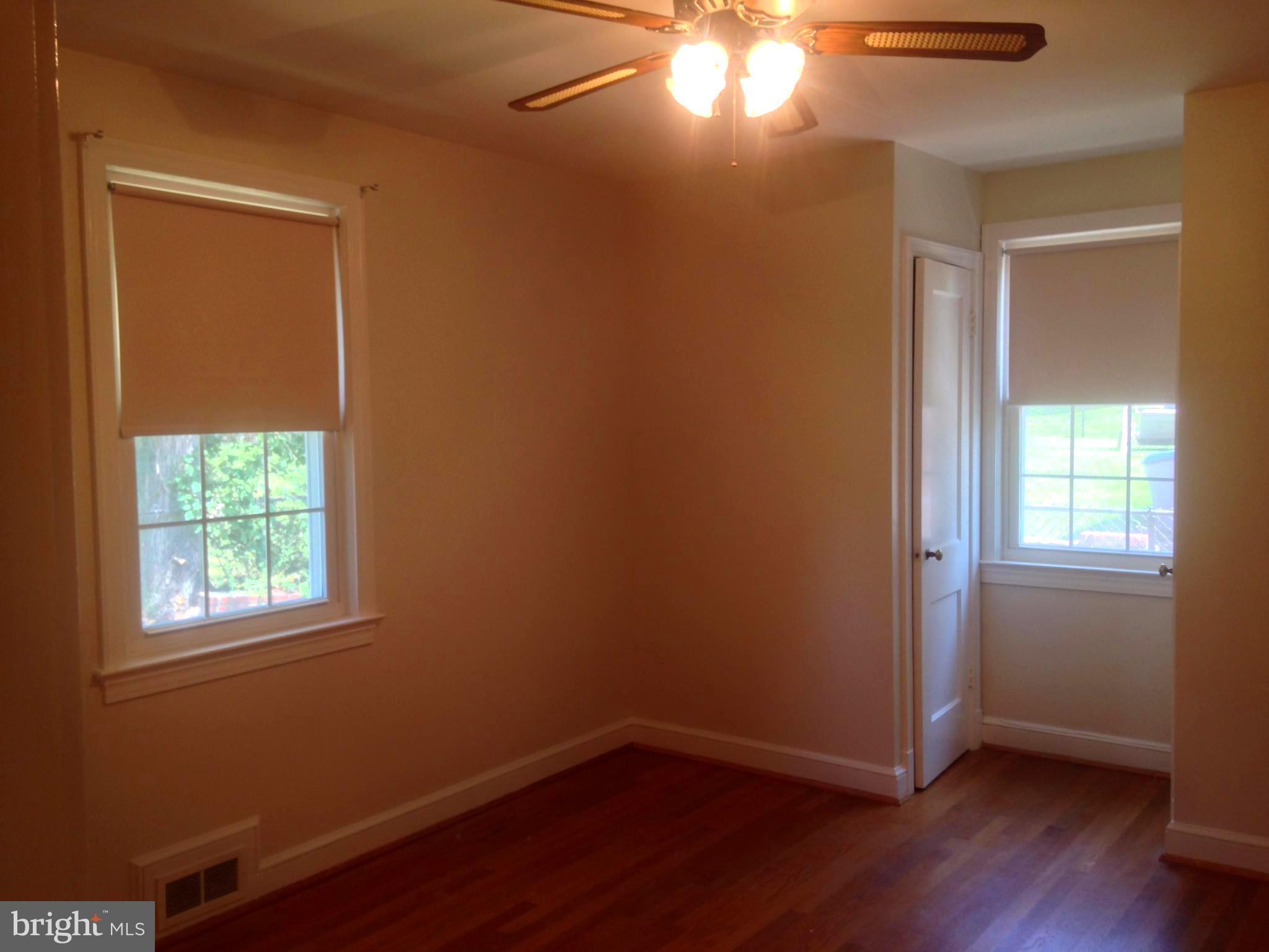 505 Stirling Road Silver Spring, MD 20901 - Photo 8 of 26 Hardwood Floors and ceiling fan in bedroom 2