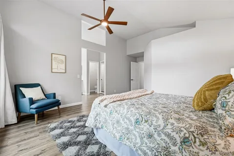 a bedroom with a bed and a chair