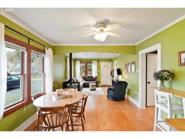 a view of a dining room with furniture window and outside view