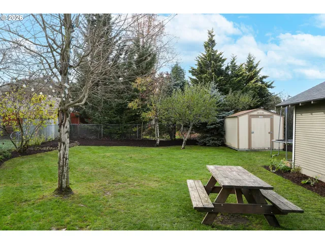 a backyard of a house with lots of green space