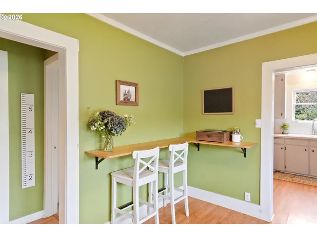 a workspace with furniture and a wooden floor