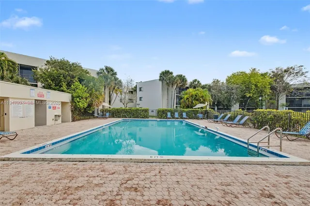 a view of a swimming pool with a patio