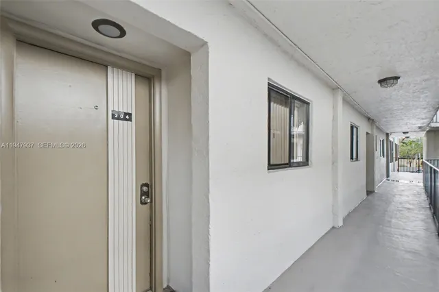 a view of a hallway with windows