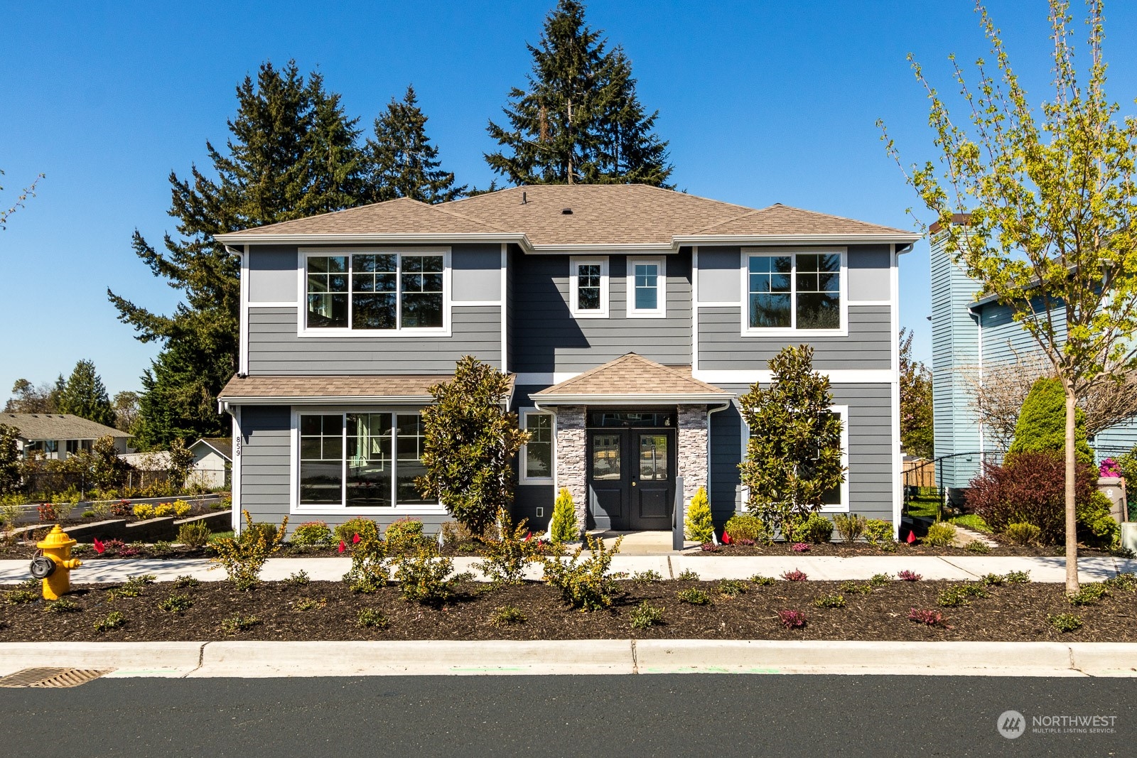 859 Field Avenue Northeast Renton, WA 98059 - Photo 1 of 27 a front view of a house with a yard