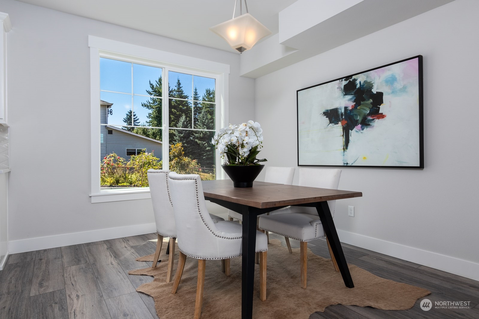 859 Field Avenue Northeast Renton, WA 98059 - Photo 12 of 27 a view of a dining room with furniture window and wooden floor