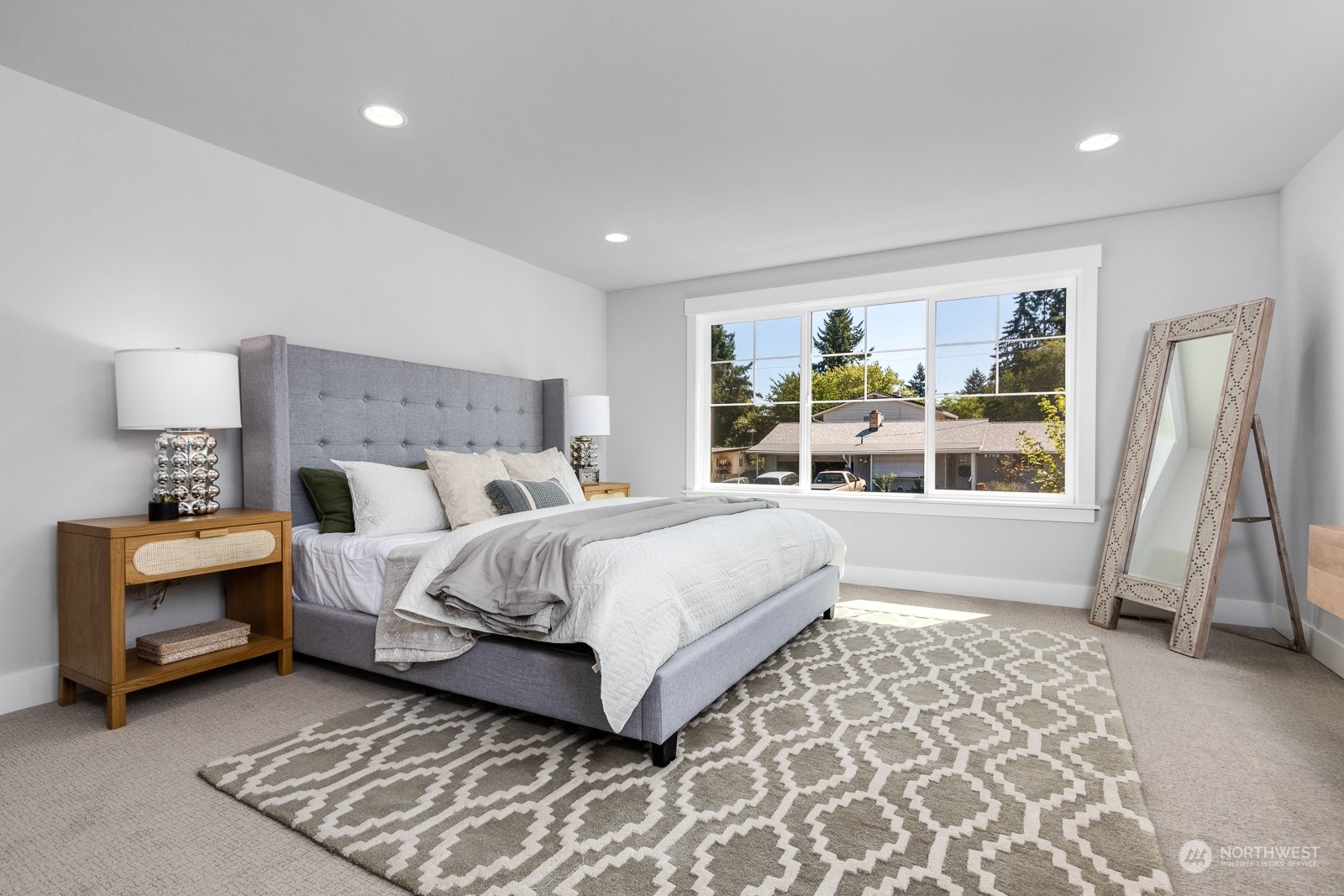 859 Field Avenue Northeast Renton, WA 98059 - Photo 17 of 27 a bed room with a bed and a large window