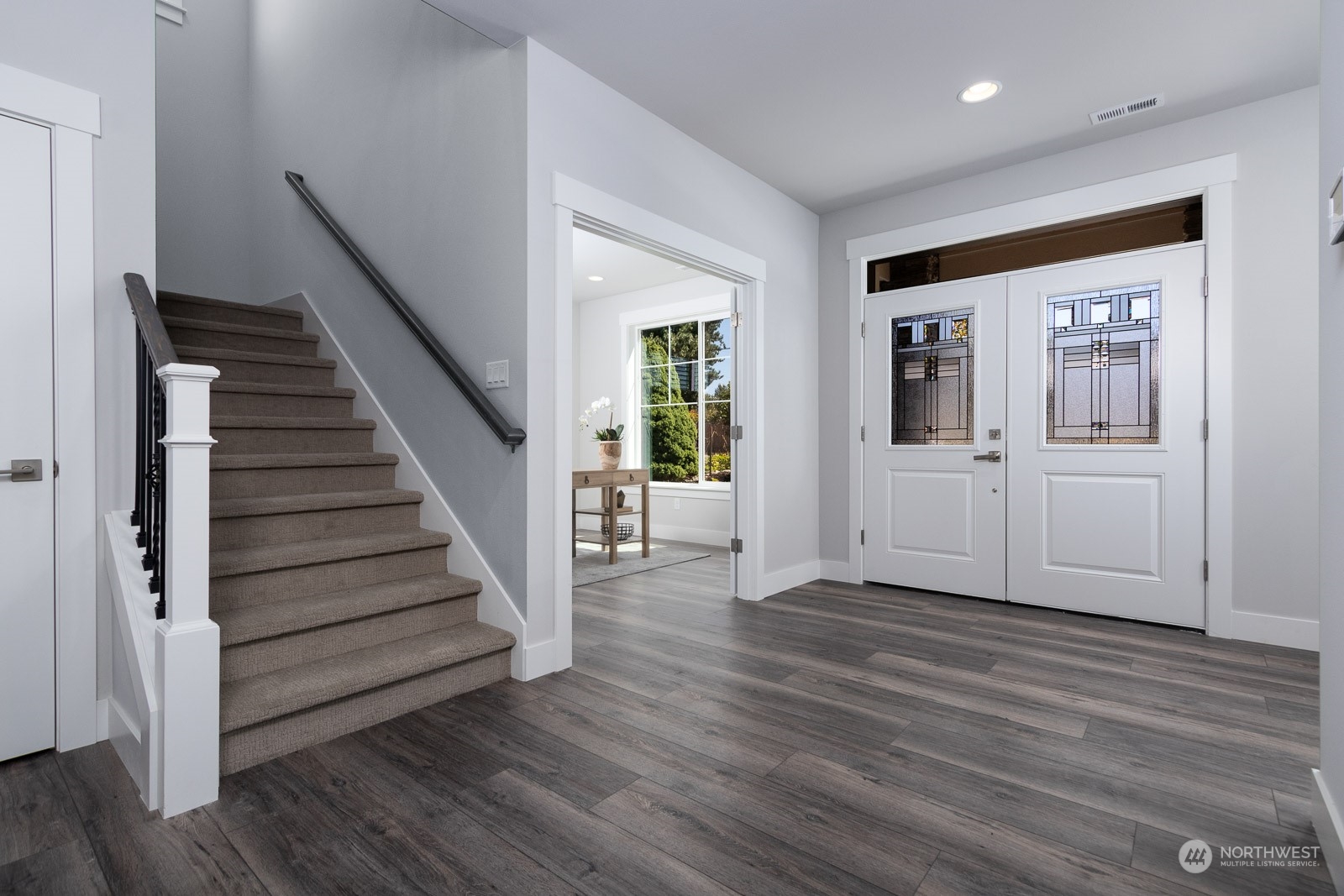 859 Field Avenue Northeast Renton, WA 98059 - Photo 2 of 27 a view of a hallway with wooden floor and stairs