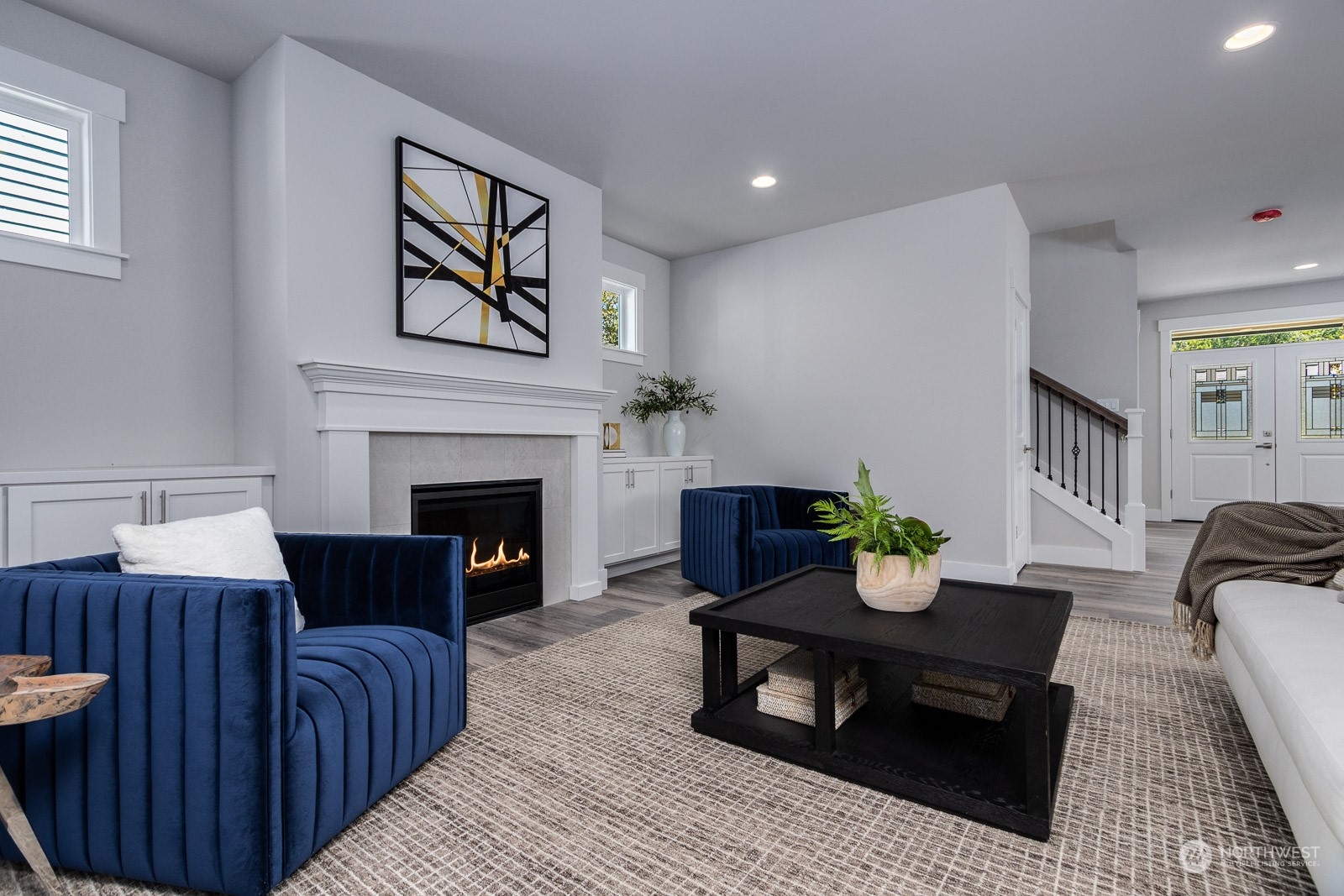 859 Field Avenue Northeast Renton, WA 98059 - Photo 5 of 27 a living room with furniture and a fireplace