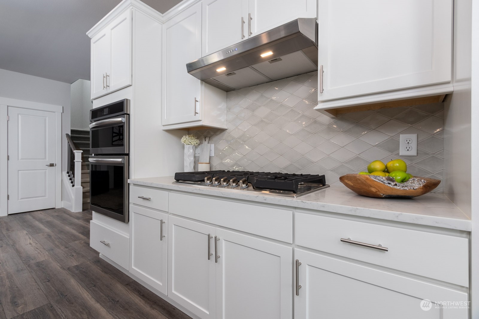 859 Field Avenue Northeast Renton, WA 98059 - Photo 8 of 27 a kitchen with stainless steel appliances white cabinets and a stove